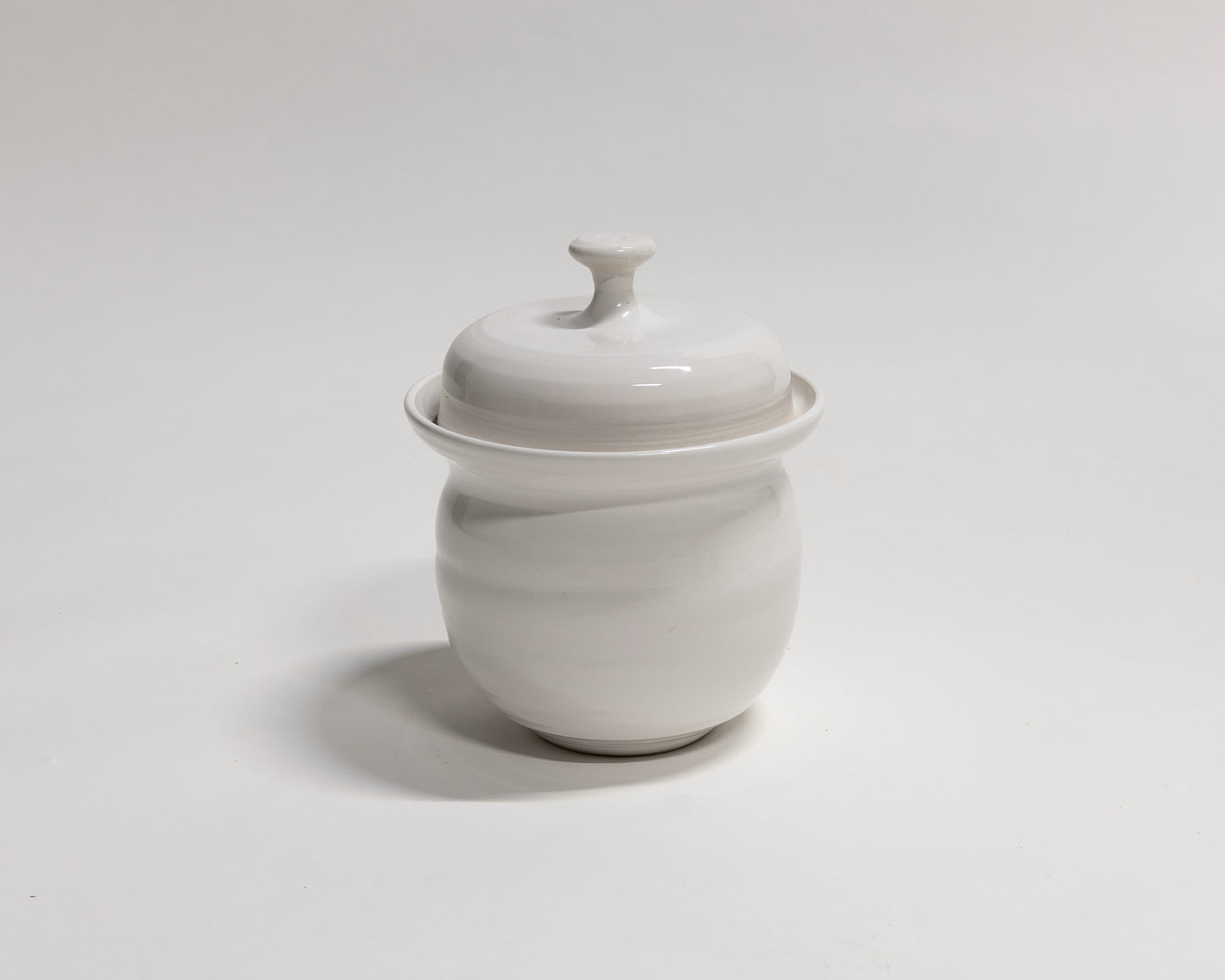 White ceramic fermentation crock with stoneware weights. Made in Australia at Valla Beach NSW.