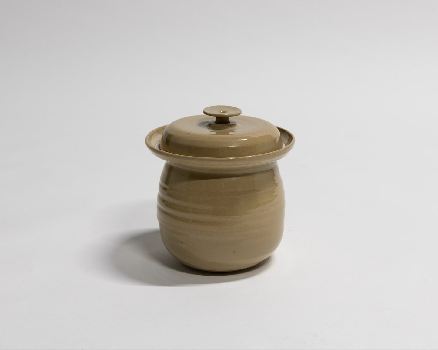Fermentation crock in coffee coloured glaze. Made from stoneware clay in NSW Australia. 